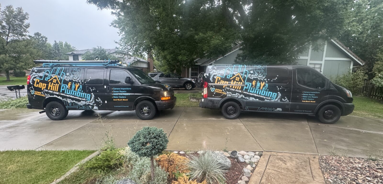 Cap Hill Plumbing vans parked in Denver — local plumbers offering sewer, drain, and water heater services.